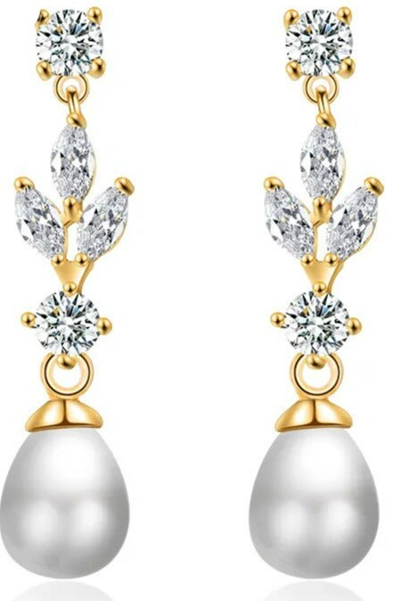 Gold Color: Comes in 3 colors. These elegant Fashion Marquise Cut Cubic Zircon Earrings feature simulated pearl and leaf-style marquise dangle, making them perfect for a special occasion. With a brilliant cubic zirconia design, these earrings combine classic elegance with modern glamour and are sure to be a favorite accessory