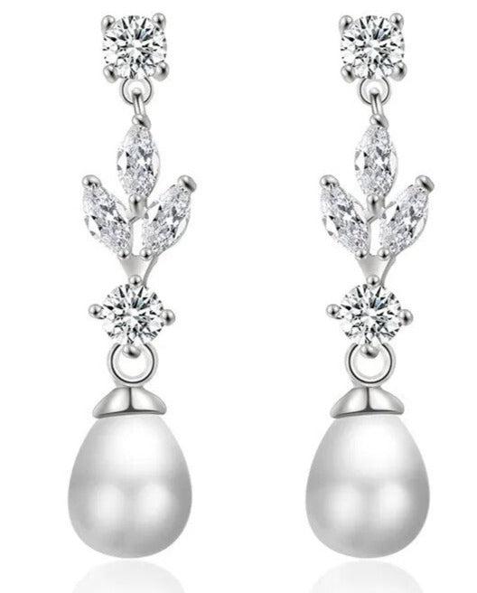 These elegant Fashion Marquise Cut Cubic Zircon Earrings feature simulated pearl and leaf-style marquise dangle, making them perfect for a special occasion. With a brilliant cubic zirconia design, these earrings combine classic elegance with modern glamour and are sure to be a favorite accessory